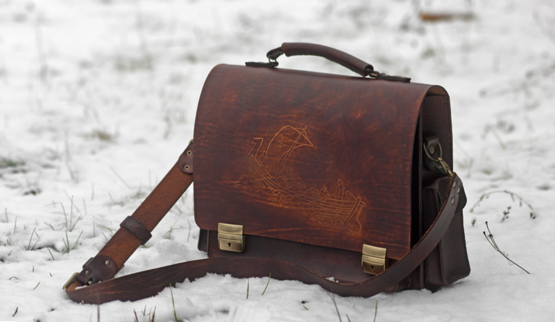 Leather briefcase with carving from Estonian mythology