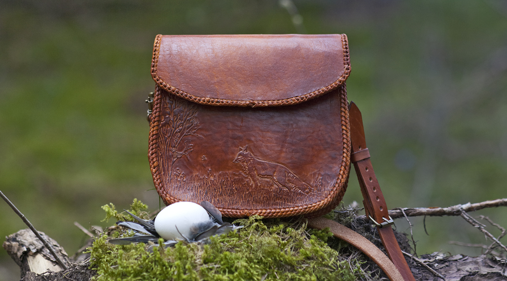 Leather handbag with carved fox
