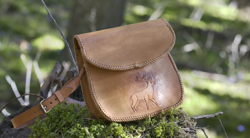 Leather handbag with hand carved deer