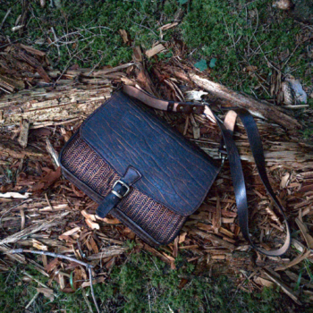 Dark brown leather shoulder bag, decorated by hand carved herringbone pattern.