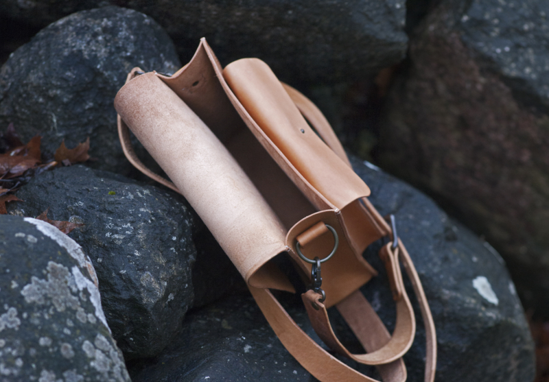 Leather shoulder bag with three pockets