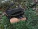 Black leather handbag with mystic flowers carvings