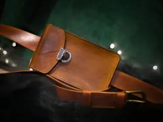 Medium brown leather bag from the front (landscape style).