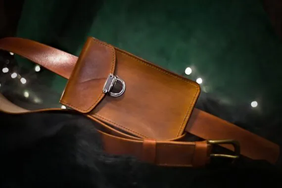 Medium brown leather bag from the front (landscape style).