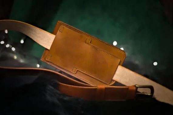 Medium brown leather bag from the back side (landscape style).