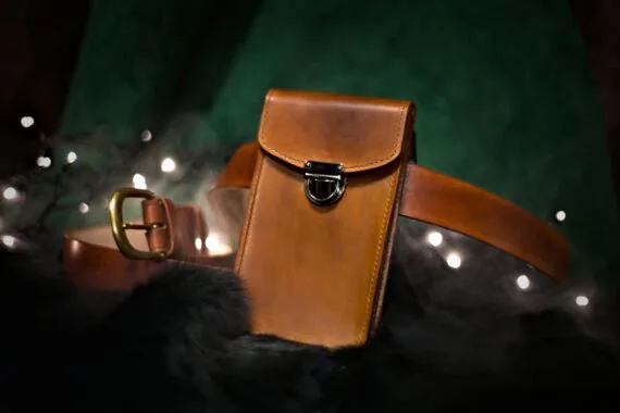Medium brown leather bag from the front (portrait style).