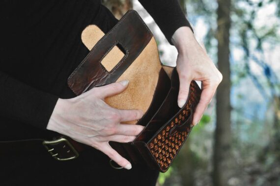 Capacious belt bag has two larger pockets and two narrow ones.