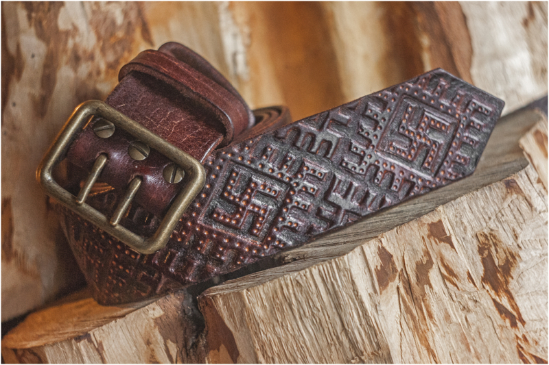 Wide leather belt with old swastika pattern