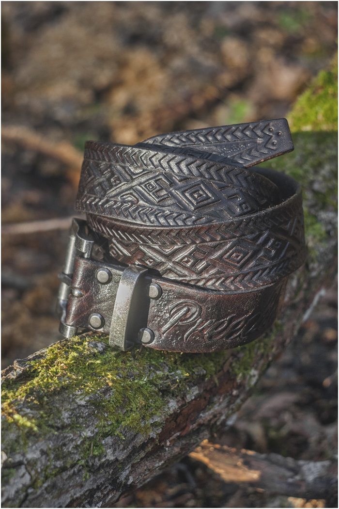 Leather belt with hand carved folk pattern
