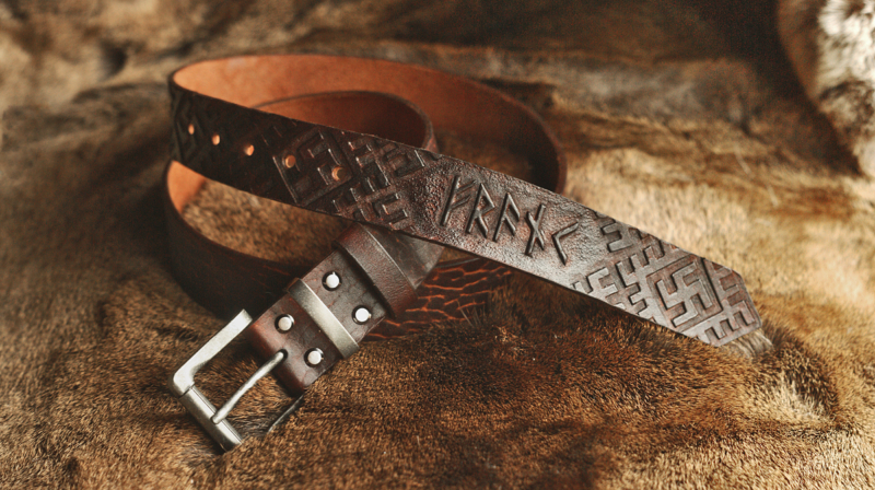 Leather belt with carved runic script and pattern