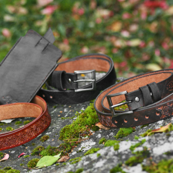 Set of carved leather belts and a phone sleeve