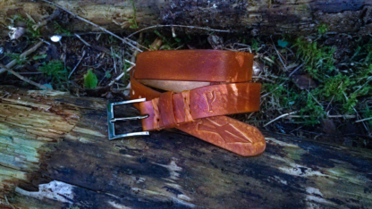 Brown leather belt with carved rune and spearhead