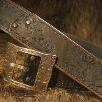 Leather belt for Santa is decorated by hand carved Santa's sledge and reindeers.