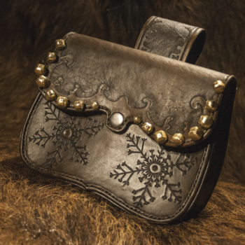 Leather belt pouch for Santa's Belt Set. Pouch is edged with small tintinnabulas. Decorated by hand carved snowflake motifs. 