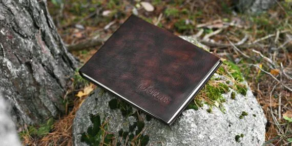 Leather cased photo album with name