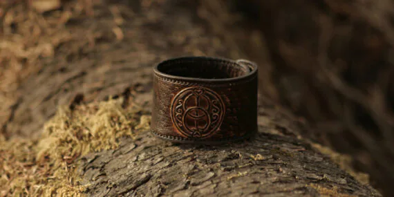 Leather bracelet with hand carved vesica piscis symbol