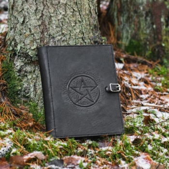 Leather covers with carved pentagram