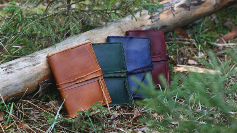 Leather notebook covers with strap tie down