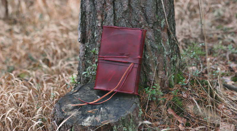 Red leather notebook covers with strap tie down