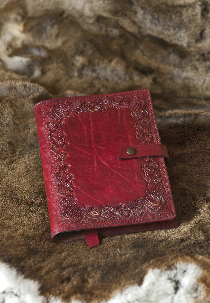 Red leather notebook covers with hand carved floral pattern