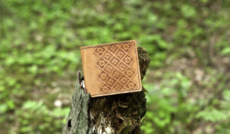 Hand carved leather card wallet. Oiled finish.