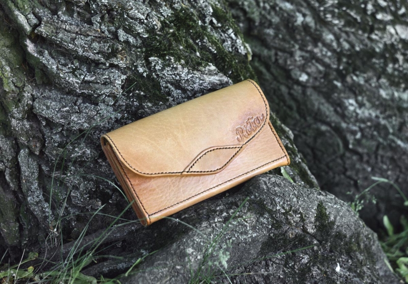 Large leather wallet for women, decorated by hand carved name.