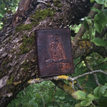 Dark brown leather wallet, decorated by hand carved eagle image.