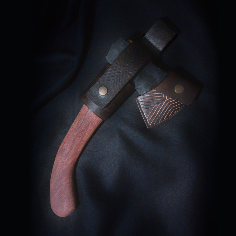 Leather axe sheath and belt loop set in dark brown. Decorated by herringbone pattern.